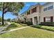 Attractive townhome community featuring manicured lawns, sidewalks, and inviting exteriors at 15825 Fishhawk View Dr, Lithia, FL 33547