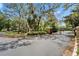 The community is accessed through an ornate, black-metal gated entrance on a landscaped traffic circle at 15825 Fishhawk View Dr, Lithia, FL 33547