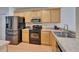 Kitchen featuring stainless steel appliances, modern countertops, and light wood cabinets at 15825 Fishhawk View Dr, Lithia, FL 33547