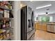 This kitchen features stainless steel appliances, light wood cabinets and granite countertops at 15825 Fishhawk View Dr, Lithia, FL 33547
