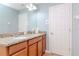 Bright bathroom features a double vanity with granite countertop and classic fixtures at 15939 Fishhawk View Dr, Lithia, FL 33547