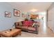 Open-concept living room featuring tile floors that flow into kitchen at 15939 Fishhawk View Dr, Lithia, FL 33547