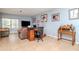 Comfortable living area with tile flooring and desk with office space at 15939 Fishhawk View Dr, Lithia, FL 33547