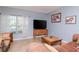 Comfortable living room with natural light and tile floors at 15939 Fishhawk View Dr, Lithia, FL 33547