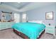 Bright main bedroom with carpeted floors and a tray ceiling at 15939 Fishhawk View Dr, Lithia, FL 33547