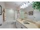 Bright bathroom with a shower-tub combo and a neutral-toned vanity with plenty of storage at 1616 Laughton Pl, Sun City Center, FL 33573