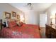 Comfortable bedroom with a tropical-themed bedspread and matching pillows at 1616 Laughton Pl, Sun City Center, FL 33573