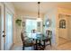 This dining area has a table, chairs, bay window, and access to the outside at 1616 Laughton Pl, Sun City Center, FL 33573