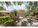 Charming single-story home with a two-car garage and mature landscaping at 1616 Laughton Pl, Sun City Center, FL 33573