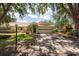Charming single-story home with a two-car garage and mature landscaping at 1616 Laughton Pl, Sun City Center, FL 33573
