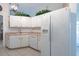Kitchen featuring white cabinets and appliances, tile floor, and pink countertops at 1616 Laughton Pl, Sun City Center, FL 33573