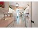 Well-lit kitchen with white cabinetry, tile floors, and modern appliances at 1616 Laughton Pl, Sun City Center, FL 33573