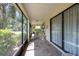 Long screened-in lanai with multiple seating areas and sliding glass doors to the interior at 1616 Laughton Pl, Sun City Center, FL 33573