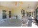 Spacious screened-in lanai with plenty of room for outdoor seating and entertaining at 1616 Laughton Pl, Sun City Center, FL 33573