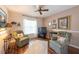 Inviting living room with comfortable seating, a flat-screen TV, and stylish decor at 1616 Laughton Pl, Sun City Center, FL 33573