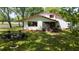 Peaceful backyard setting with a cozy fire pit area, perfect for outdoor gatherings and relaxation at 1691 Ridge Top Dr, Tarpon Springs, FL 34688