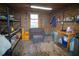Inside the barn, find a resting area with wooden walls, storage, and practical design for rural life at 1691 Ridge Top Dr, Tarpon Springs, FL 34688