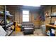The barn's cozy interior features wooden walls, a resting spot, and storage for a comfortable and practical space at 1691 Ridge Top Dr, Tarpon Springs, FL 34688