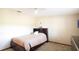 Cozy bedroom with a bed, built-in headboard, and soft neutral tones creating a relaxing atmosphere at 1691 Ridge Top Dr, Tarpon Springs, FL 34688