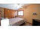 Relaxing bedroom with a large closet and a ceiling fan to provide comfort at 1691 Ridge Top Dr, Tarpon Springs, FL 34688