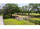 Picturesque land with green grass and mature trees, perfect for building or recreation at 1691 Ridge Top Dr, Tarpon Springs, FL 34688