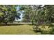 Picturesque pasture surrounded by mature trees, ready for building or recreation at 1691 Ridge Top Dr, Tarpon Springs, FL 34688