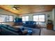 Inviting living area with wood ceiling, tile floors and comfortable leather seating at 1691 Ridge Top Dr, Tarpon Springs, FL 34688