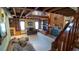 Spacious open floorplan living room with wood burning fireplace, shelving, staircase to the loft area at 1691 Ridge Top Dr, Tarpon Springs, FL 34688