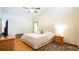 Bedroom featuring hardwood floors, a ceiling fan, and a vaulted ceiling at 1691 Ridge Top Dr, Tarpon Springs, FL 34688