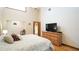 Bedroom featuring hardwood floors, a ceiling fan, and a vaulted ceiling at 1691 Ridge Top Dr, Tarpon Springs, FL 34688