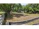 Beautiful pasture with mature trees and secure fencing, perfect for horses or livestock at 1691 Ridge Top Dr, Tarpon Springs, FL 34688