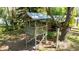 A charming treehouse with a wooden frame creates an enchanting space for fun and imagination at 1691 Ridge Top Dr, Tarpon Springs, FL 34688