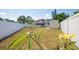 Large fenced backyard with a shed and a fire pit area at 208 Ne Lincoln N Cir, St Petersburg, FL 33702