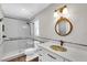 Beautiful bathroom featuring a tiled shower and a decorative sink at 208 Ne Lincoln N Cir, St Petersburg, FL 33702