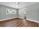 Bedroom featuring hardwood floors and an ensuite bathroom at 208 Ne Lincoln N Cir, St Petersburg, FL 33702