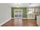 Open living space featuring stainless appliances, hardwood floors, and sliding glass doors at 208 Ne Lincoln N Cir, St Petersburg, FL 33702