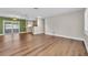 Open living space featuring stainless appliances, hardwood floors, and access to the outdoors at 208 Ne Lincoln N Cir, St Petersburg, FL 33702