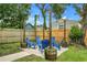 Cozy backyard seating area with string lights, perfect for outdoor relaxation at 2215 Thrace St, Tampa, FL 33605