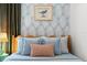 Comfortable bedroom with light blue accents, stylish wall art, and calming color scheme at 2215 Thrace St, Tampa, FL 33605