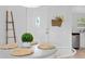 Close up of the dining table and front door featuring a leafy potted plant as a centerpiece at 2215 Thrace St, Tampa, FL 33605