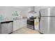 Well-lit kitchen features stainless steel appliances and sleek design at 2215 Thrace St, Tampa, FL 33605