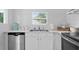 Modern kitchen featuring stainless steel appliances and fixtures, and bright subway tile at 2215 Thrace St, Tampa, FL 33605