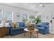 Comfortable living room with ample natural light and cozy blue furniture at 2215 Thrace St, Tampa, FL 33605