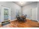 Breakfast nook with hardwood floors and access to the backyard pool area at 23717 Harmony Ln, Land O Lakes, FL 34639