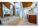 Spacious bathroom with a soaking tub, a wood ceiling, and a glass enclosed shower at 2392 Hillcreek E Cir, Clearwater, FL 33759