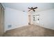 Spacious bedroom featuring neutral carpet, closet with folding doors, and direct access to the screened-in pool at 2392 Hillcreek E Cir, Clearwater, FL 33759