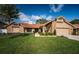 Charming single-Gathering home featuring a well-manicured lawn, brick accents and a clay tile roof at 2392 Hillcreek E Cir, Clearwater, FL 33759
