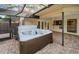 Enjoy outdoor relaxation in this private backyard hot tub with brick patio at 2392 Hillcreek E Cir, Clearwater, FL 33759