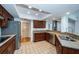 Well-equipped kitchen with stainless steel appliances, granite countertops and wood cabinets at 2392 Hillcreek E Cir, Clearwater, FL 33759