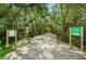 The nature trail invites visitors to explore a serene and lush path through the woods at 2392 Hillcreek E Cir, Clearwater, FL 33759